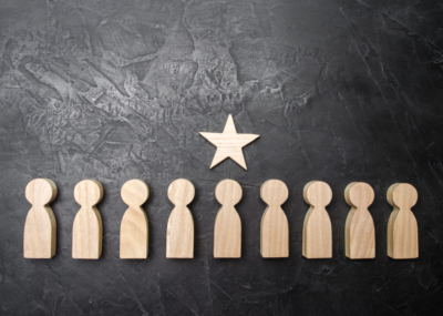 A,Star,Above,A,Person,Who,Stands,In,A,Row