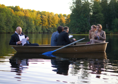 People,In,Suits,Are,Working,In,A,Boat,On,Sunset